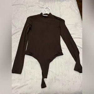 Brown turtleneck contour bodysuit